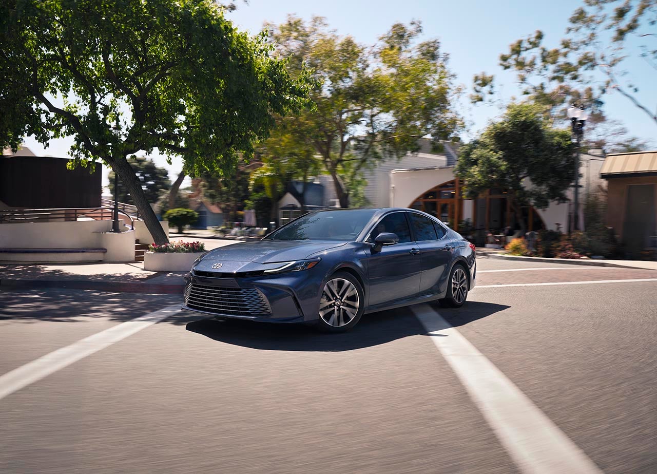 Blue Toyota Camry on road